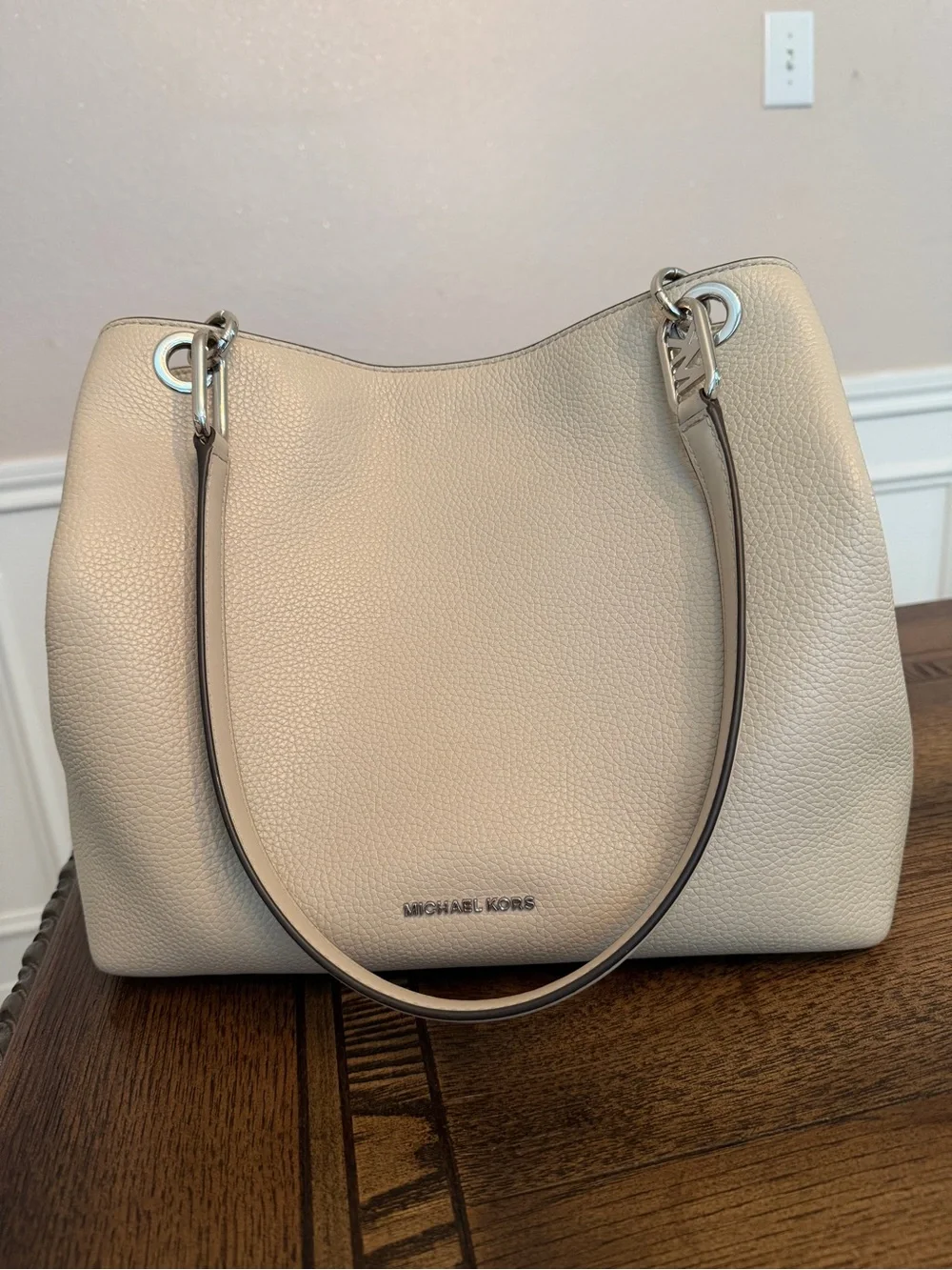 Michael Kors Raven pebbled leather shoulder bag featuring silver-tone hardware